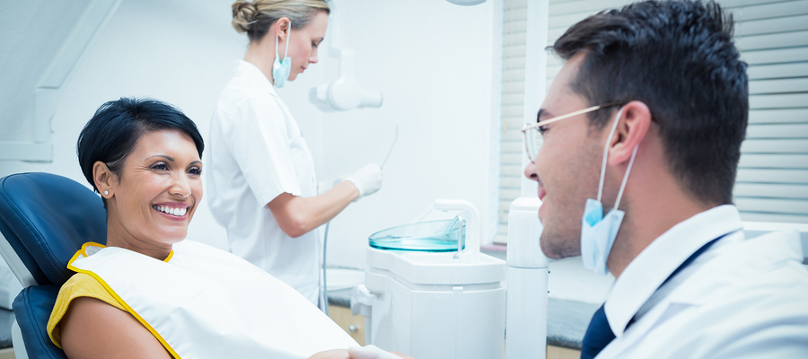 Woman shaking hands with dentist