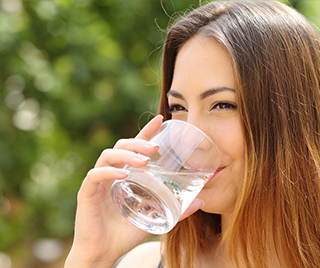 Drinking water after eating certain foods helps clean your gums.