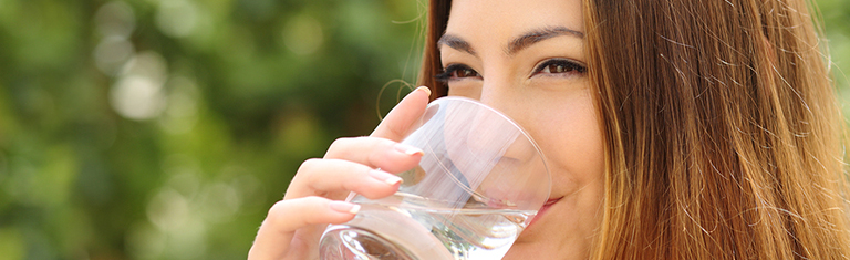 Drinking water after eating certain foods helps clean your gums.
