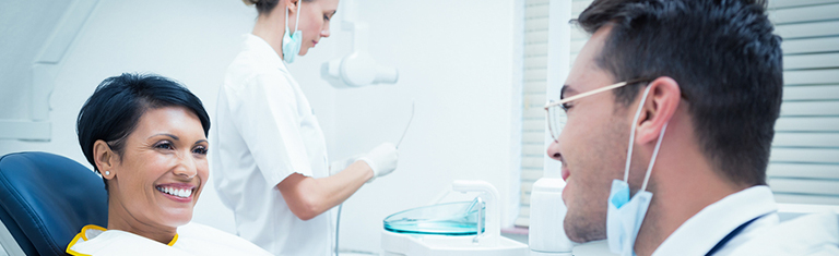 Woman shaking hands with dentist